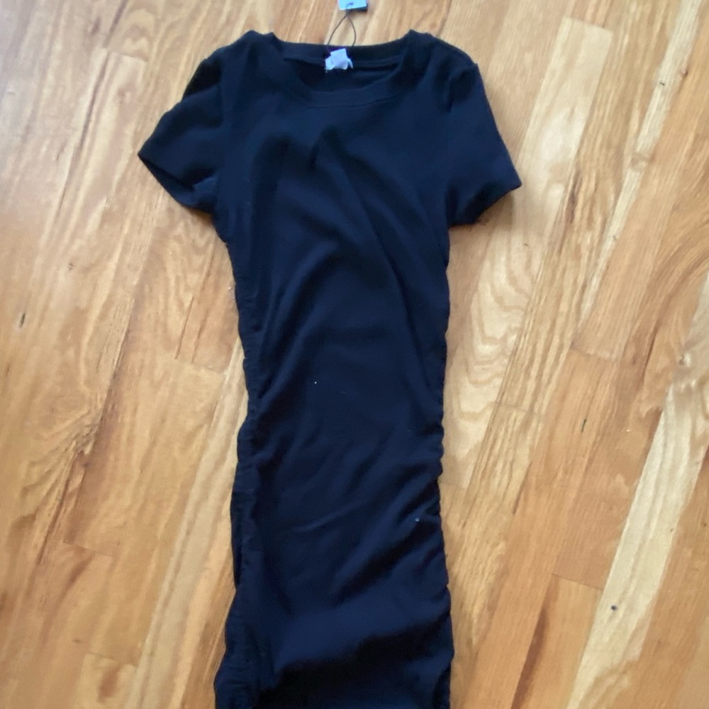 Right black tshirt dress with ruching on the side with ties on both ends.